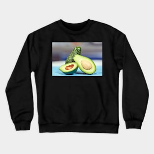 Fresh avocado on a table Crewneck Sweatshirt